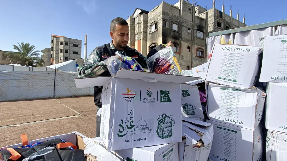 Egyptian committee distributes school bags and stationery to students in the sector