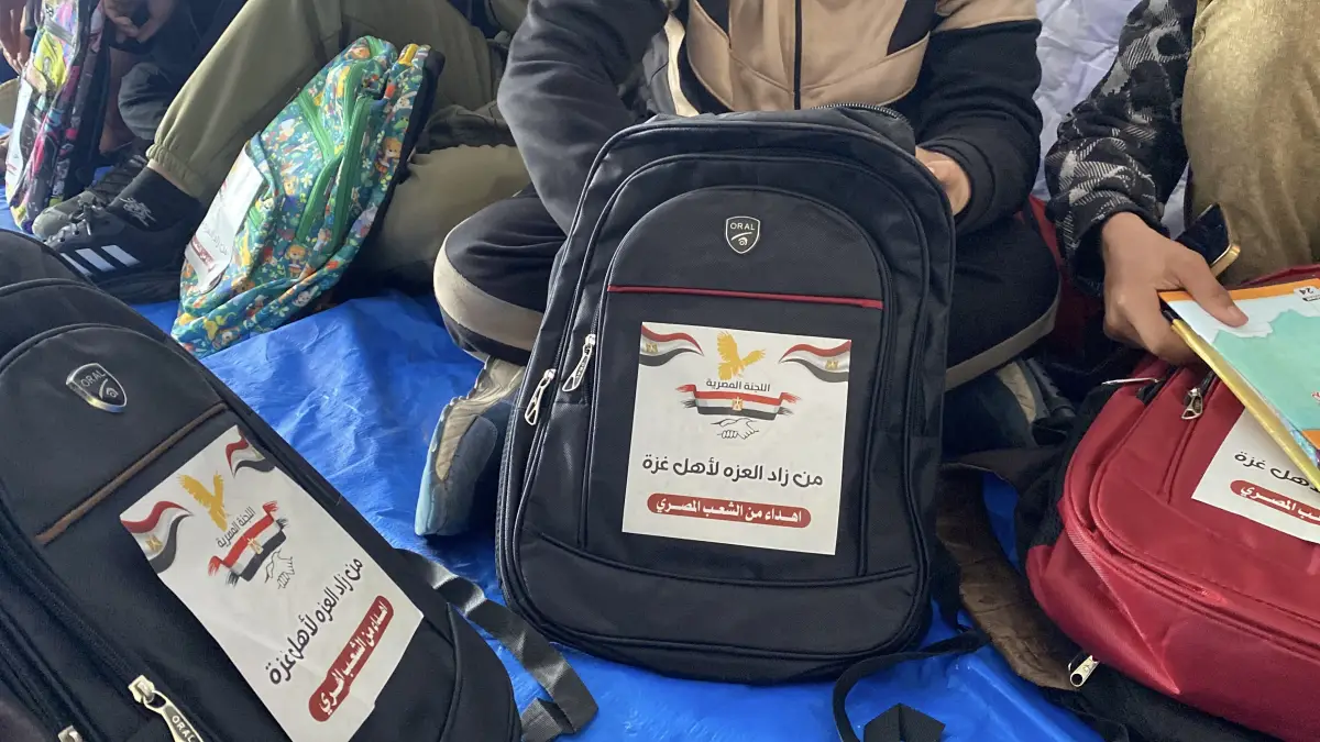 Egyptian committee distributes school bags and stationery to students in the sector