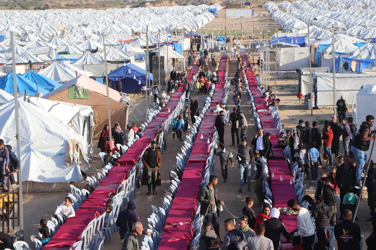 Organization of the largest collective iftar banquet inside the Egyptian camp 18