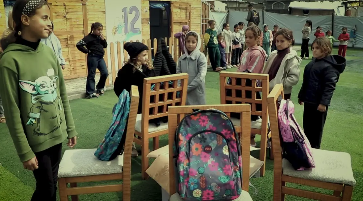 The Egyptian Committee distributes school bags and stationery to children in the orphan ca